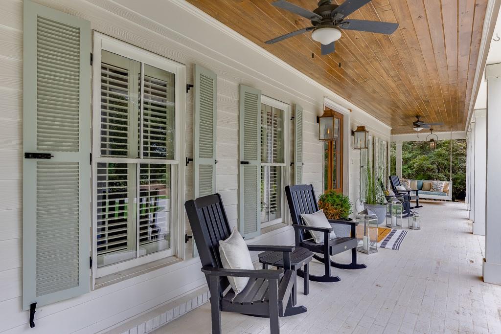 986 Austin Road Winder, GA 30680 - Photo 6 of 135 a view of a patio with a table and chairs and potted plants