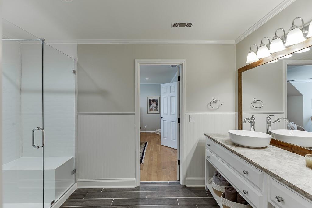 986 Austin Road Winder, GA 30680 - Photo 64 of 135 a bathroom with a granite countertop sink and a mirror