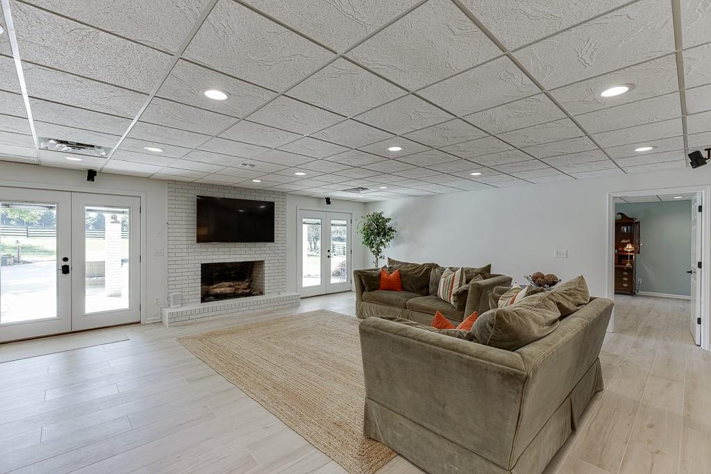 986 Austin Road Winder, GA 30680 - Photo 76 of 135 a living room with furniture and a fireplace