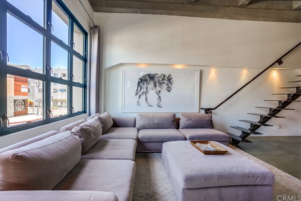 100 West 5th Street Long Beach, CA 90802 - Photo 18 of 53 a living room with furniture and a large window