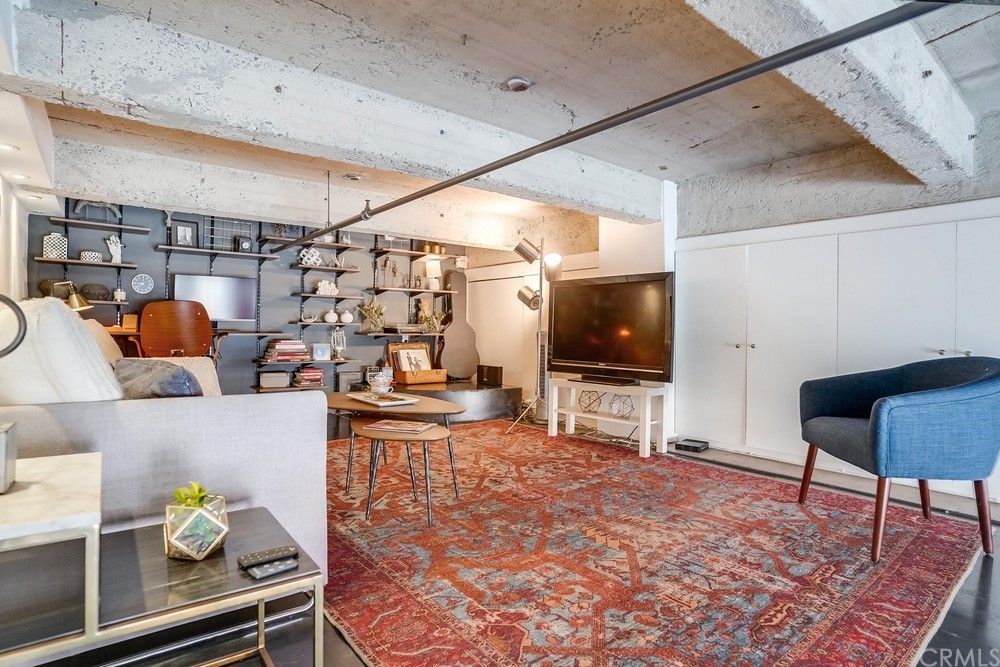 100 West 5th Street Long Beach, CA 90802 - Photo 27 of 53 a living room with furniture and a flat screen tv