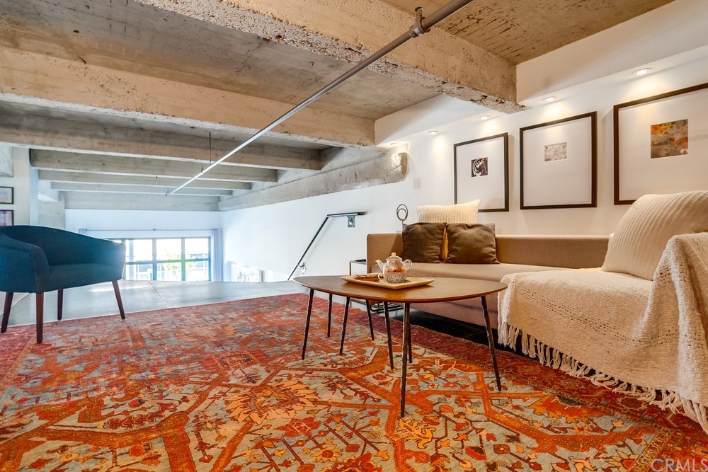 100 West 5th Street Long Beach, CA 90802 - Photo 29 of 53 a living room with furniture and a wooden floor