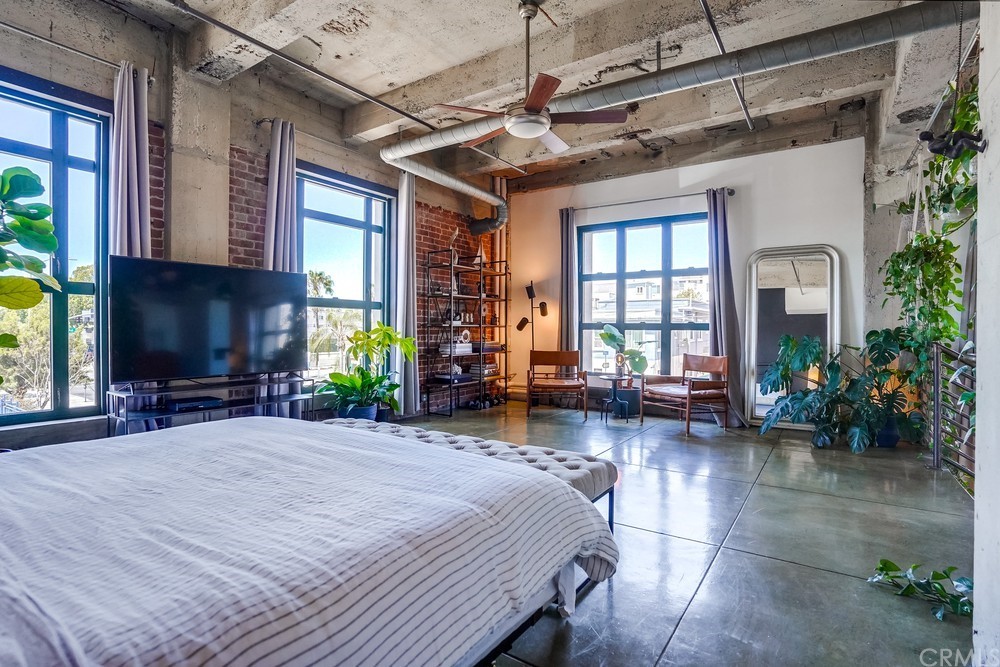 100 West 5th Street Long Beach, CA 90802 - Photo 36 of 53 a front view of a house with outdoor seating and a potted plant