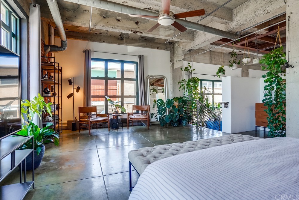 100 West 5th Street Long Beach, CA 90802 - Photo 39 of 53 a swimming pool with outdoor seating and a potted plant