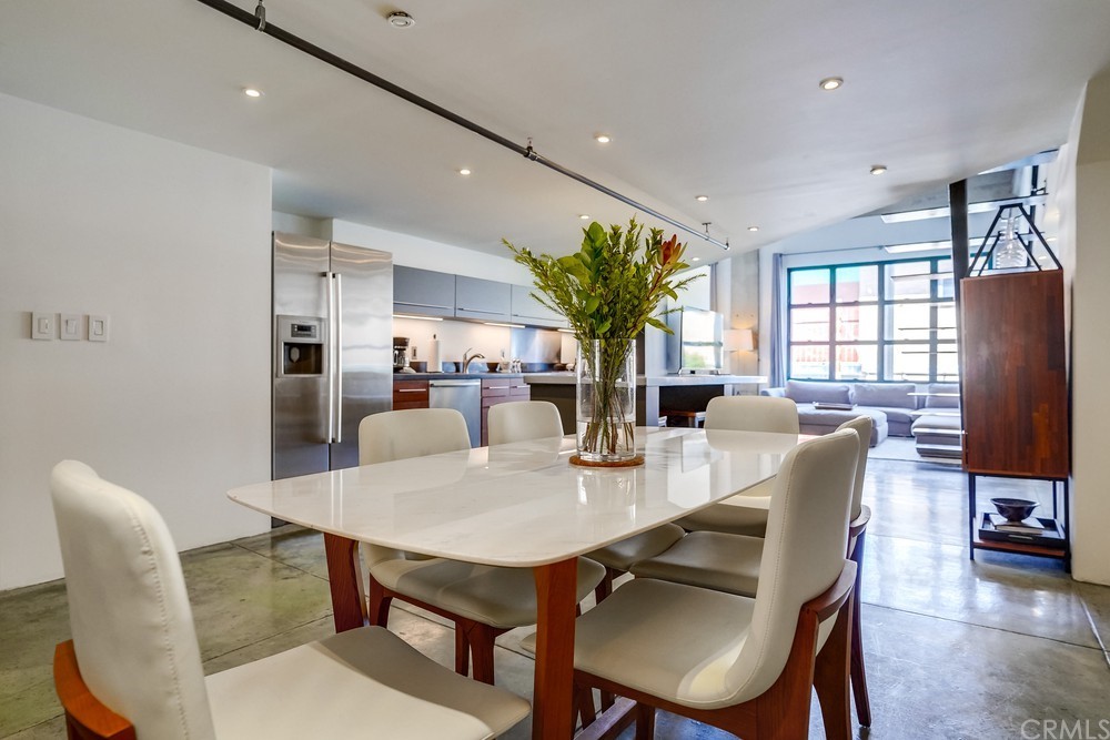100 West 5th Street Long Beach, CA 90802 - Photo 5 of 53 a dining room with furniture a window and a chandelier