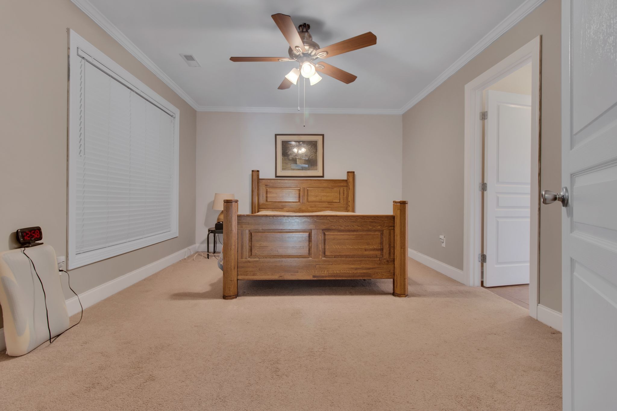 1166 Perry Road Manchester, TN 37355 - Photo 23 of 40 a bedroom with a bed and a chandelier