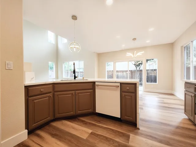 a large bathroom with a large mirror vanity and sink