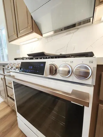 a kitchen with a stove and a microwave