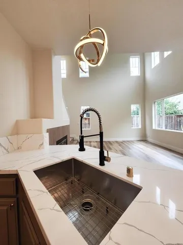 a kitchen with a sink a counter space and a window