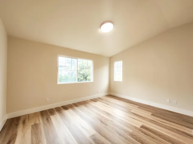 a bathroom with a double vanity sink and mirror