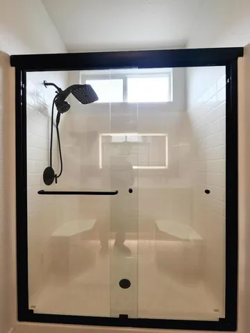 a bathroom with a toilet and a rug