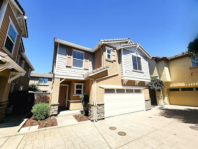 a front view of a house with a garage