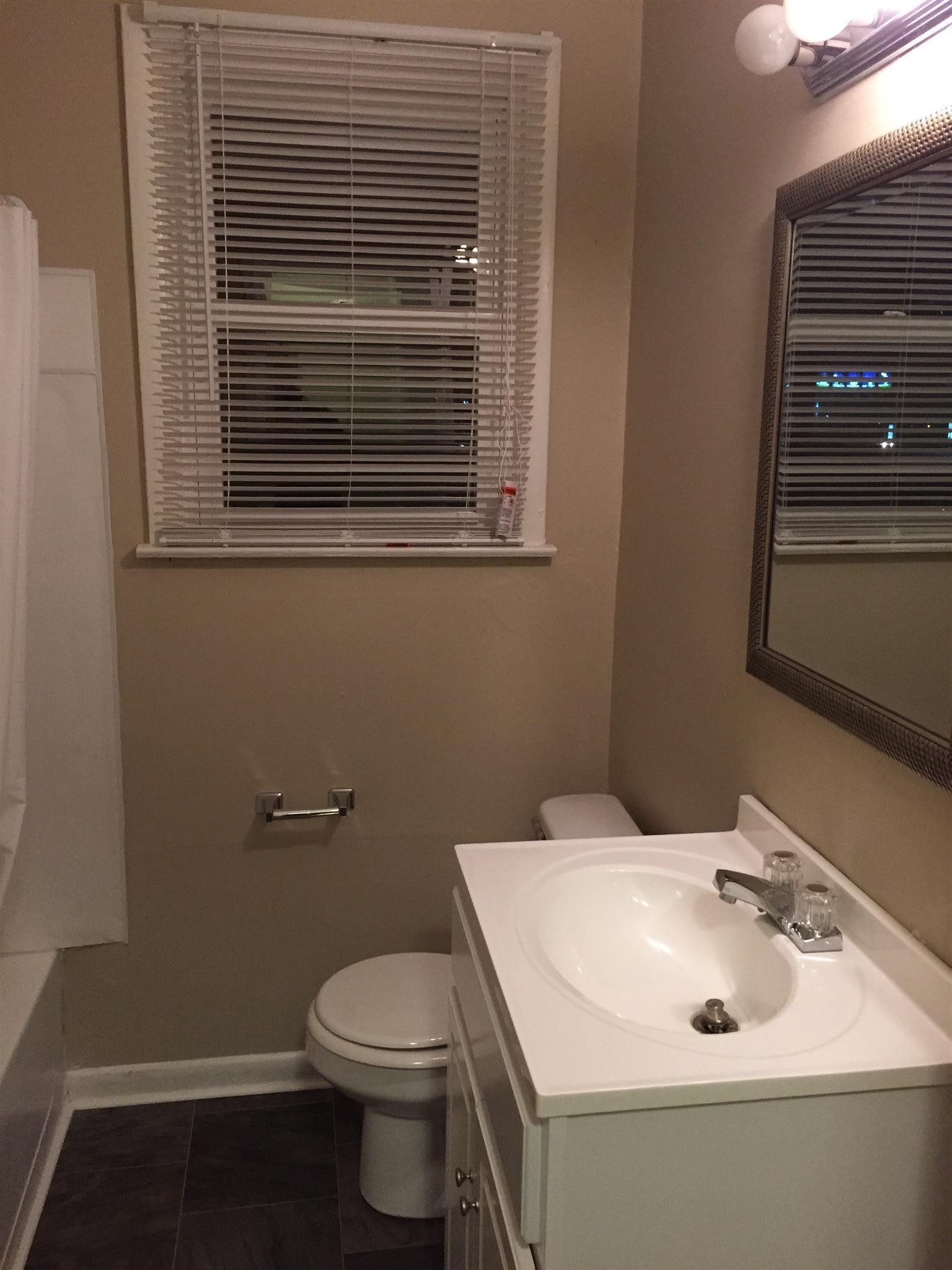 1302 Atlas Street Murfreesboro, TN 37130 - Photo 7 of 10 a bathroom with a sink and a toilet