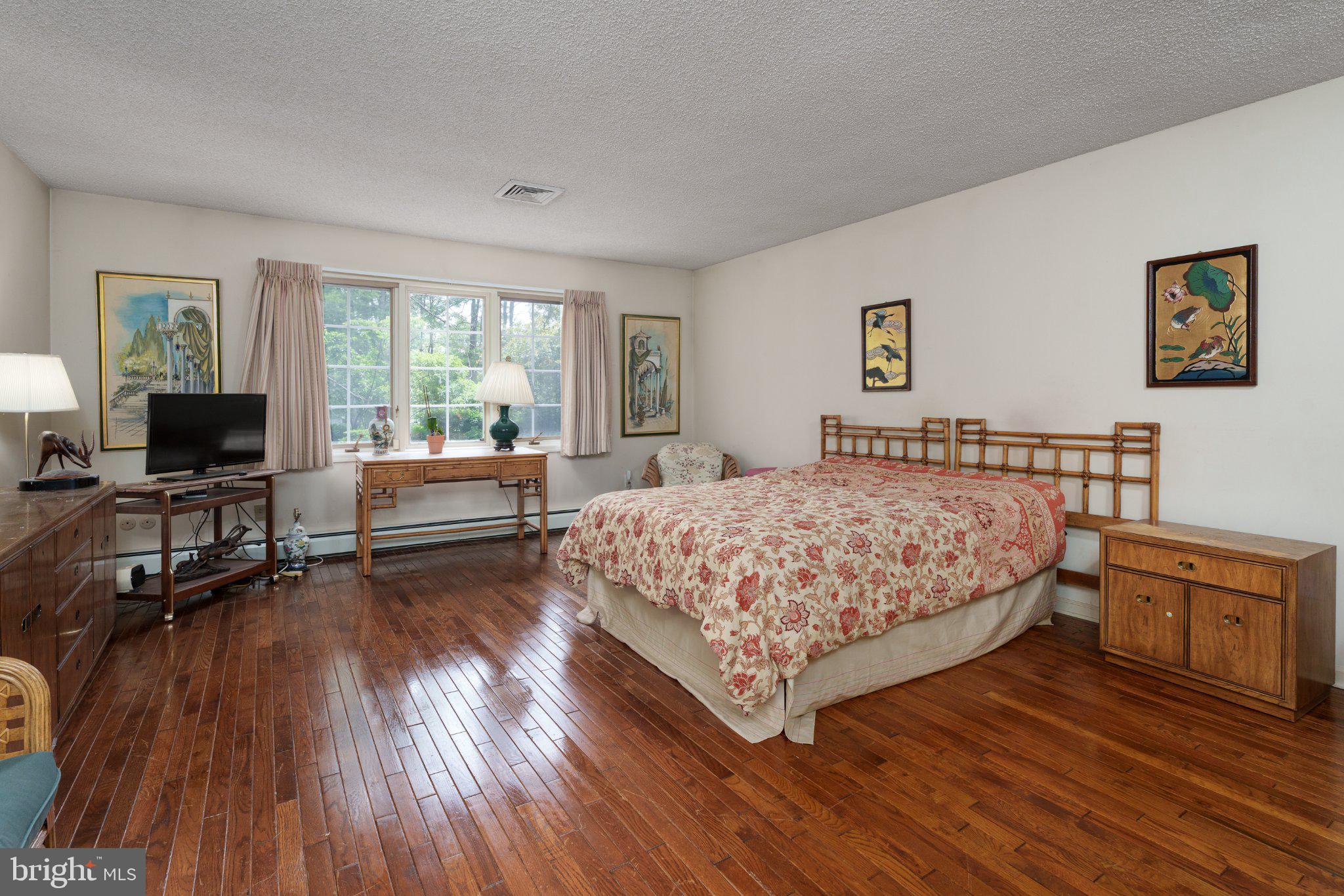 338 Gallup Road Princeton, NJ 08540 - Photo 27 of 53 a bedroom with a bed and a flat screen tv
