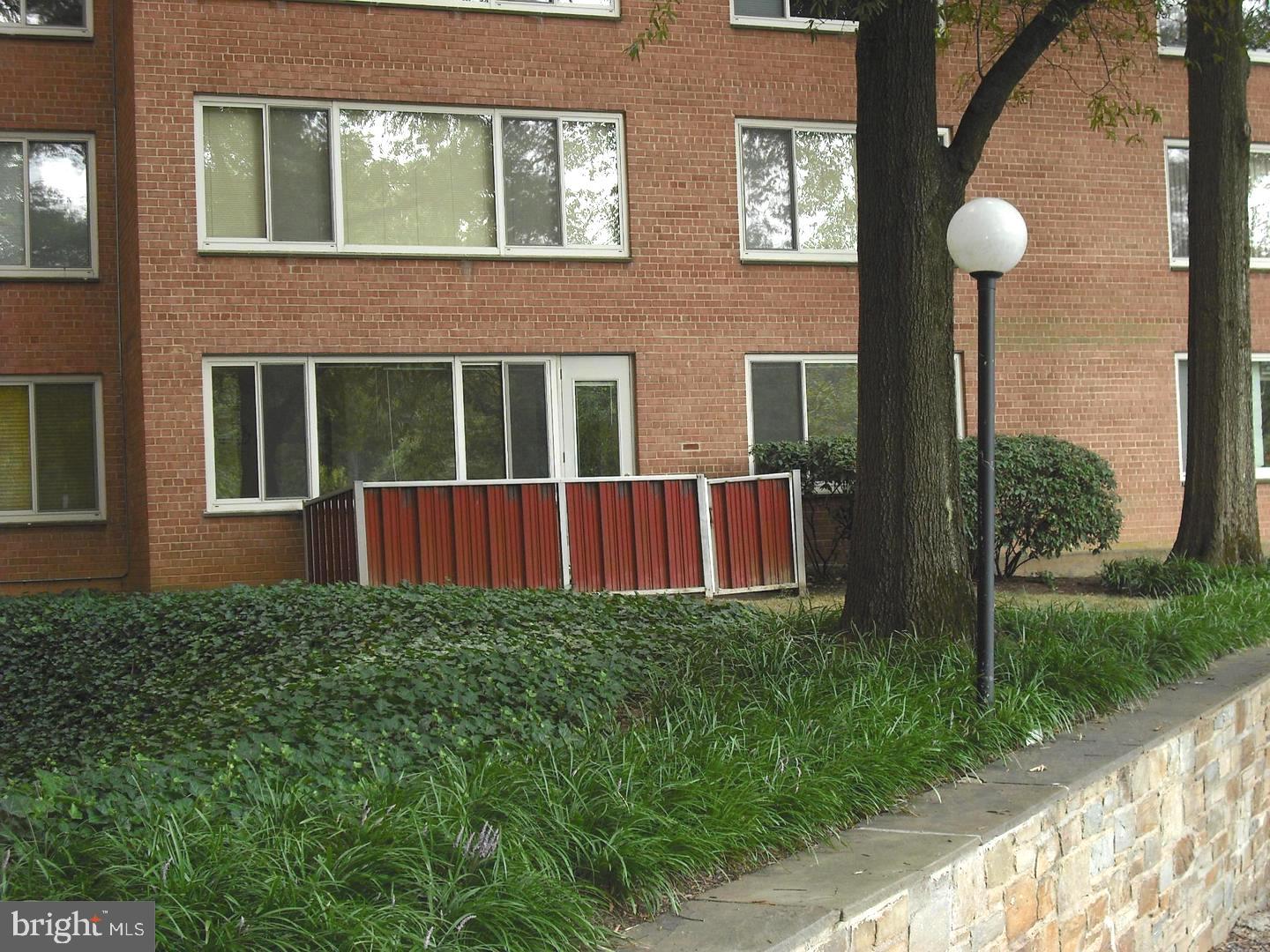 4000 Tunlaw Road Northwest, Unit 223 Washington, DC 20007 - Photo 16 of 28 a view of a house with a backyard