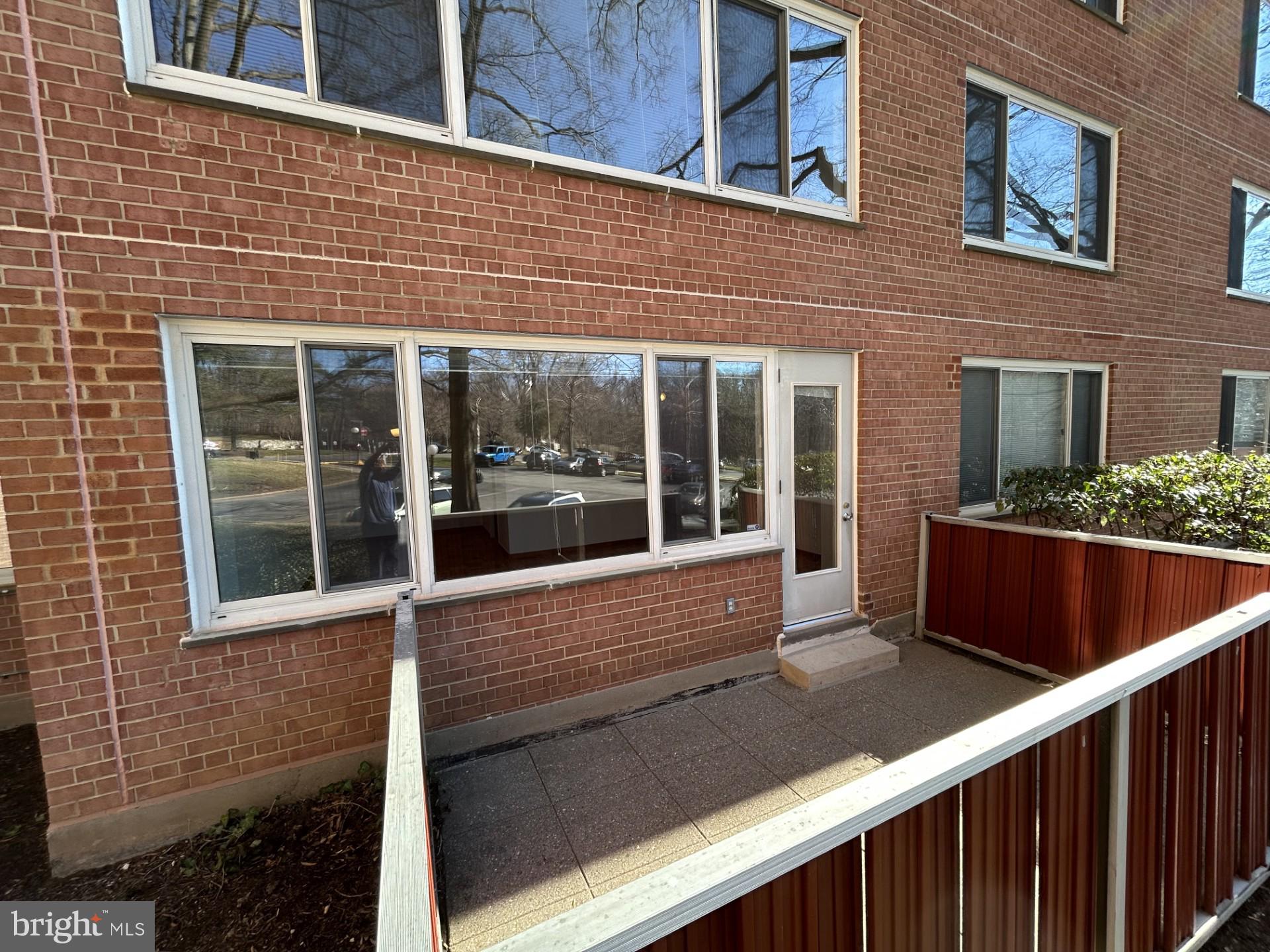 4000 Tunlaw Road Northwest, Unit 223 Washington, DC 20007 - Photo 18 of 28 a view of house with outdoor space and porch