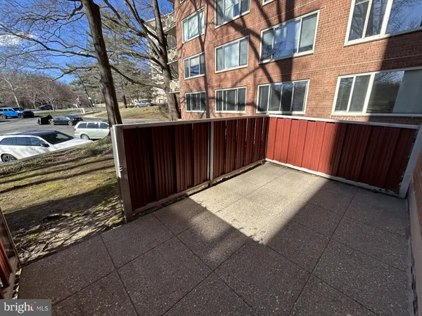 a view of a brick house with a large space