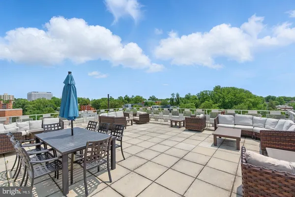 an outdoor space with furniture and garden