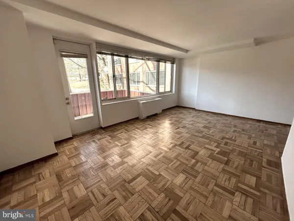 a view of an empty room and window
