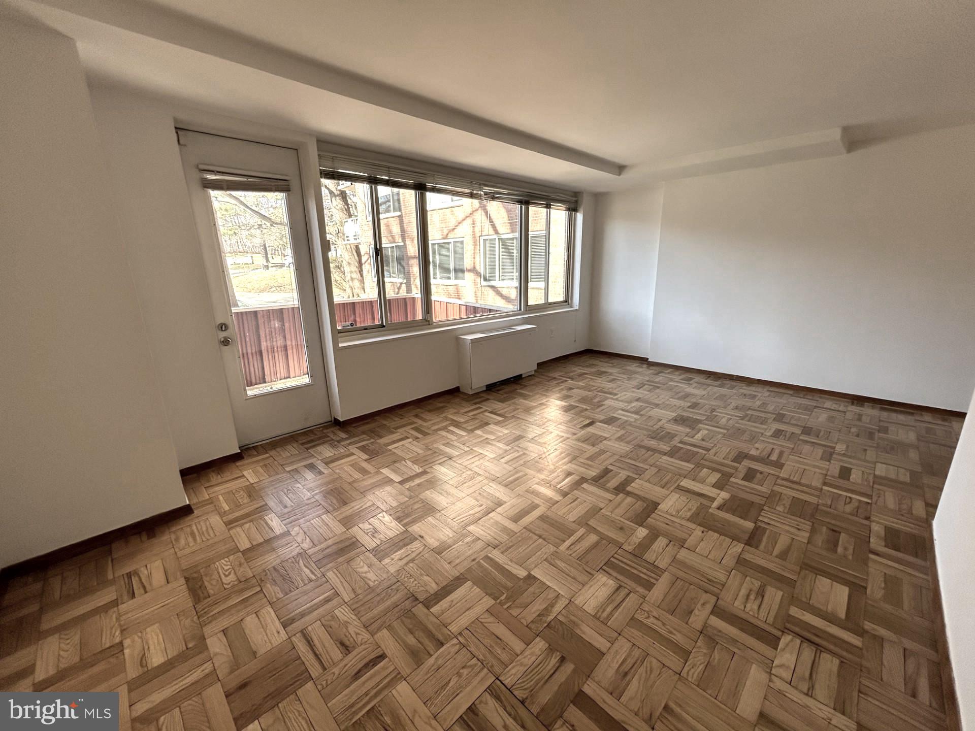 4000 Tunlaw Road Northwest, Unit 223 Washington, DC 20007 - Photo 8 of 28 a view of an empty room and window