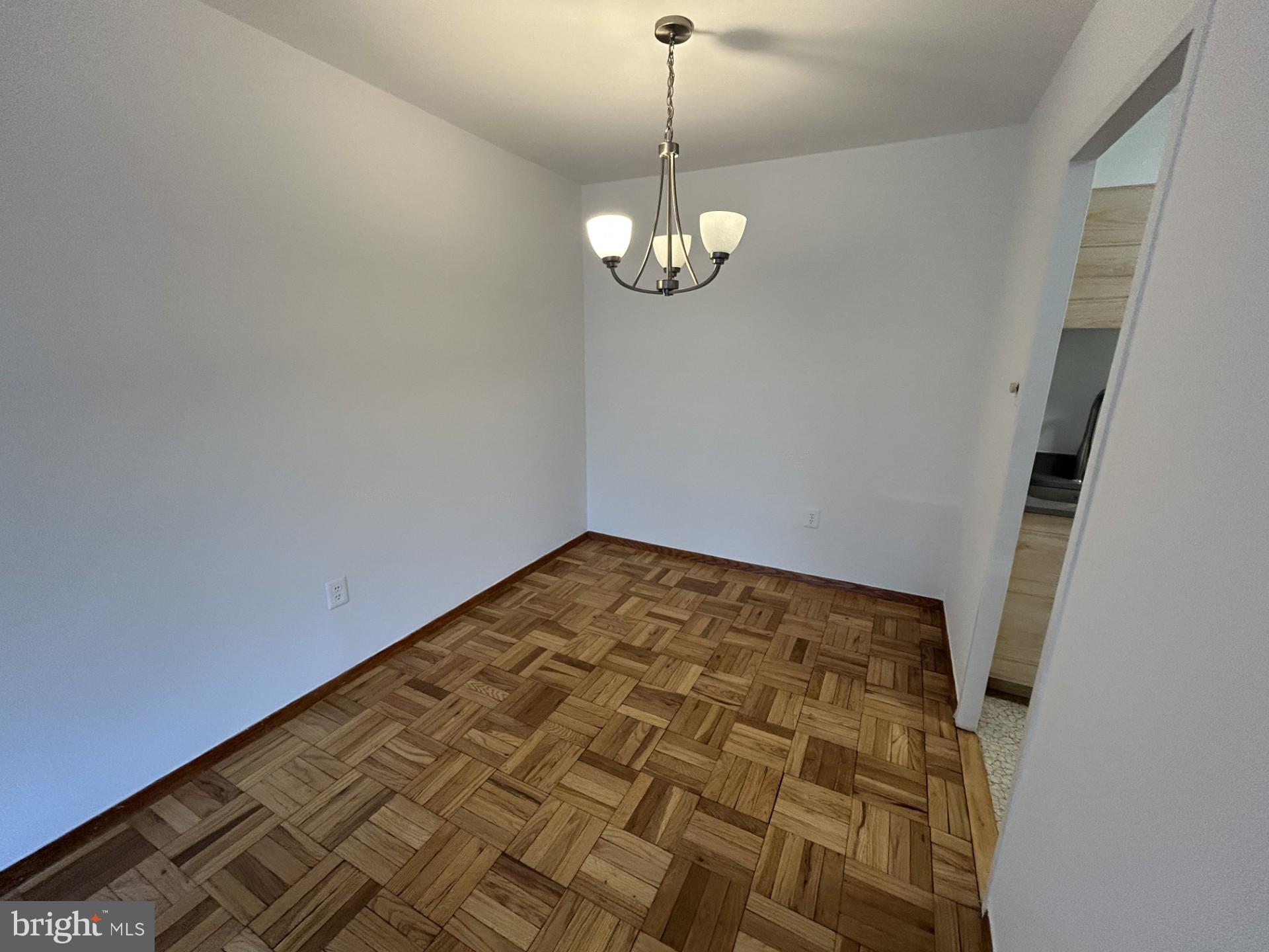 4000 Tunlaw Road Northwest, Unit 223 Washington, DC 20007 - Photo 10 of 28 a view of empty room with wooden floor
