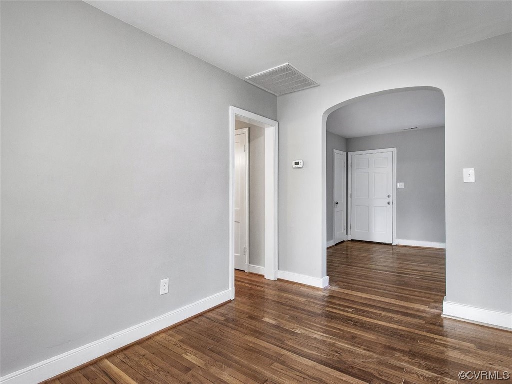 6903 Everview Road Richmond, VA 23226 - Photo 12 of 34 a view of an empty room with wooden floor and a window