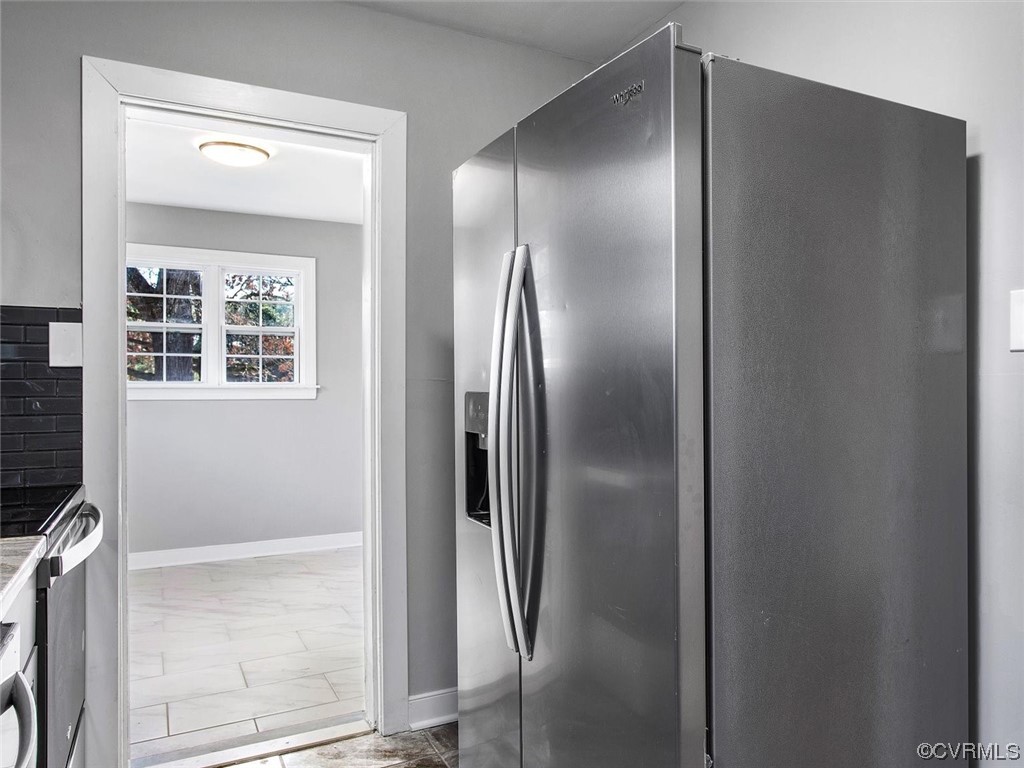 6903 Everview Road Richmond, VA 23226 - Photo 16 of 34 a bathroom with a glass shower door and a mirror