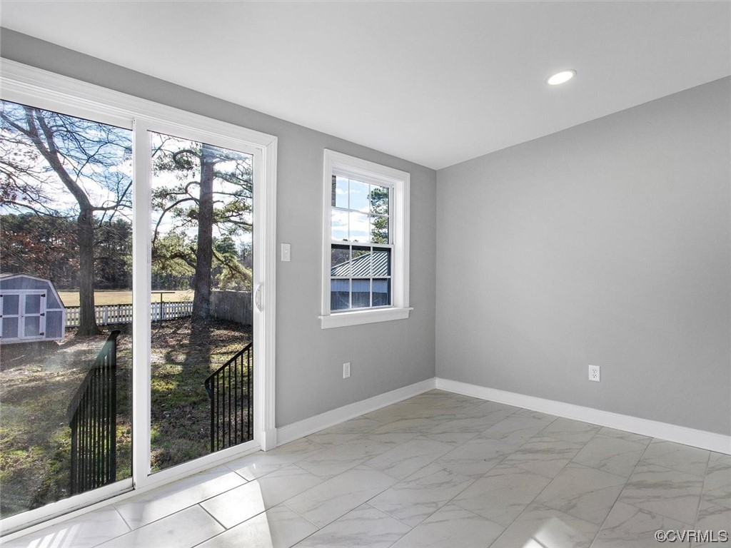 6903 Everview Road Richmond, VA 23226 - Photo 18 of 34 a view of an empty room with wooden floor and a window