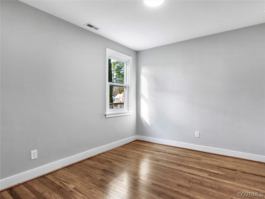 6903 Everview Road Richmond, VA 23226 - Photo 20 of 34 wooden floor in an empty room with a window