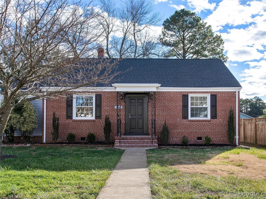 6903 Everview Road Richmond, VA 23226 - Photo 2 of 34 a front view of a house with garden
