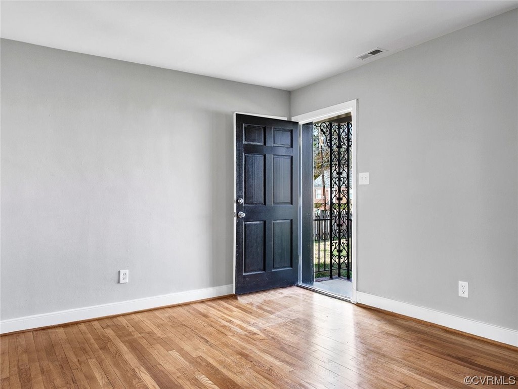 6903 Everview Road Richmond, VA 23226 - Photo 4 of 34 a view of an empty room with wooden floor