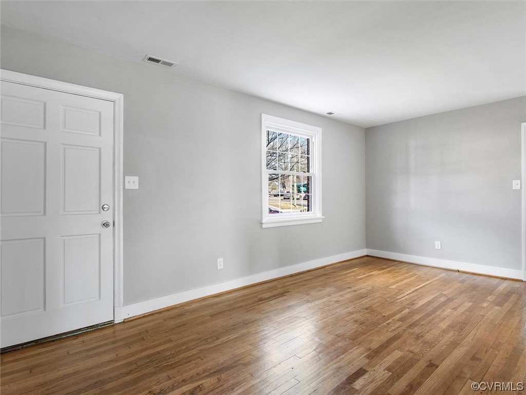 6903 Everview Road Richmond, VA 23226 - Photo 5 of 34 a view of an empty room with wooden floor and a window
