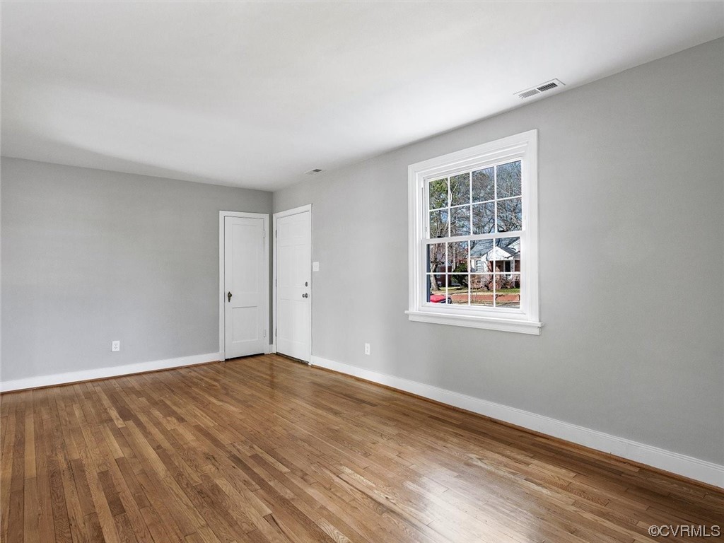 6903 Everview Road Richmond, VA 23226 - Photo 6 of 34 a view of an empty room with wooden floor and a window