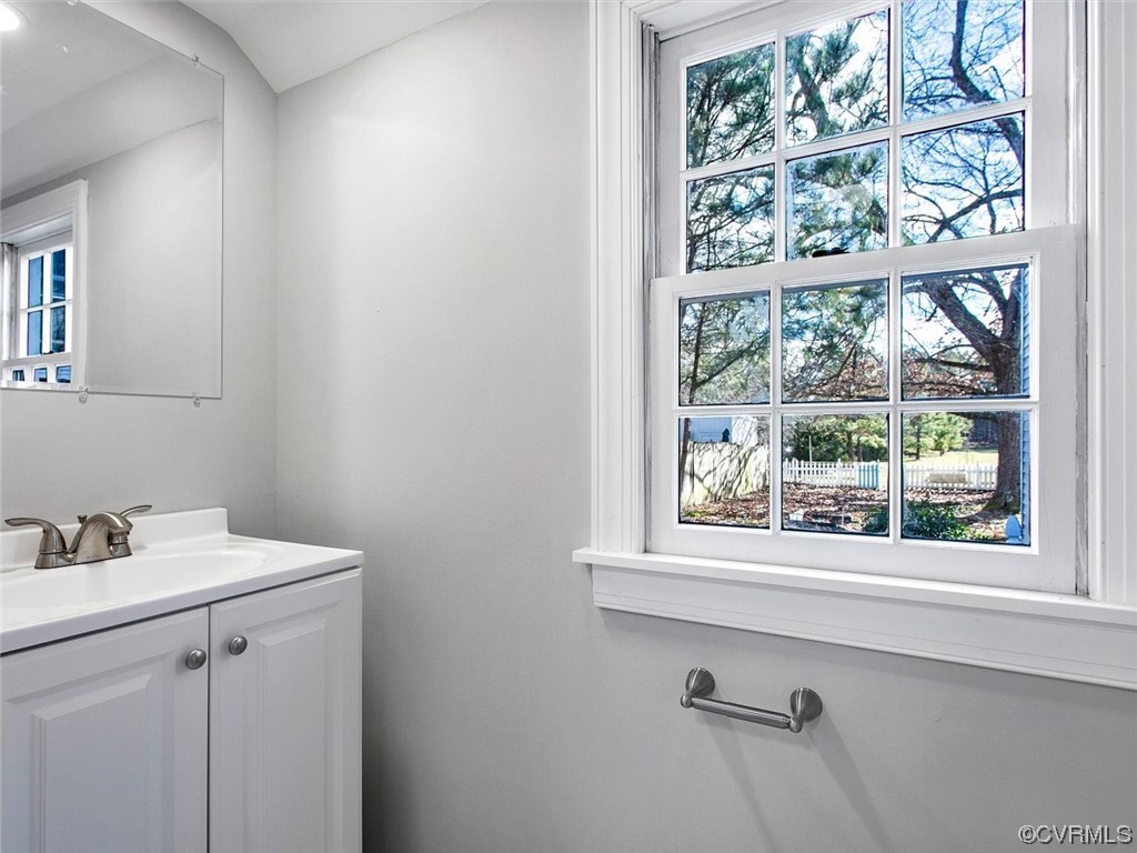 6903 Everview Road Richmond, VA 23226 - Photo 10 of 34 a bathroom with a sink a vanity and a window