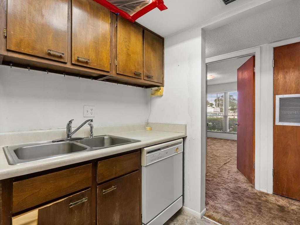 1935 South Conway Road, Unit L3 Orlando, FL 32812 - Photo 13 of 29 a kitchen with a sink and cabinets