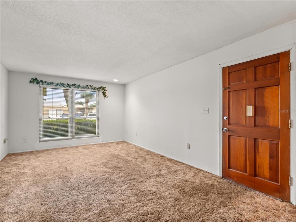 1935 South Conway Road, Unit L3 Orlando, FL 32812 - Photo 4 of 29 an empty room with windows and closet