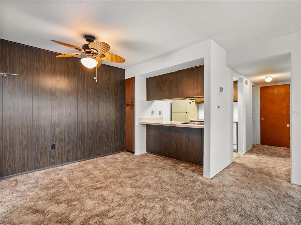 1935 South Conway Road, Unit L3 Orlando, FL 32812 - Photo 6 of 29 a bedroom with a bed and a chandelier