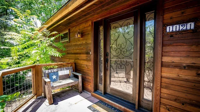a view of a two chairs in the balcony