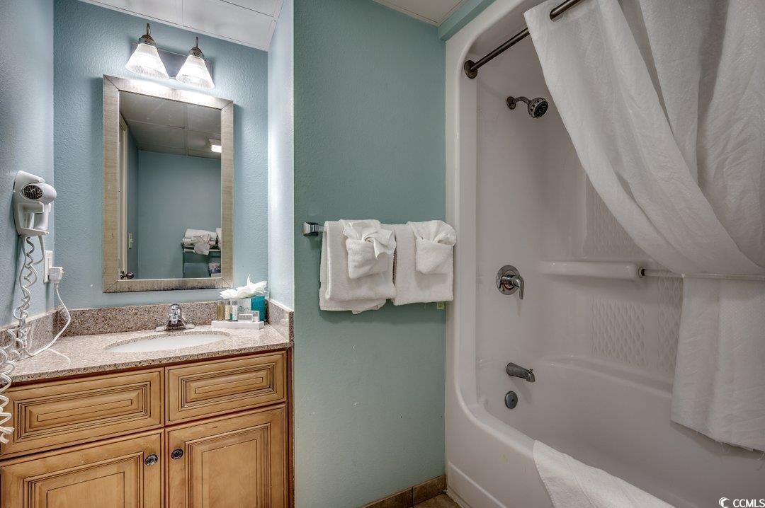 7100 North Ocean Boulevard, Unit 825 Myrtle Beach, SC 29572 - Photo 10 of 38 Bathroom with shower / bath combination with curta