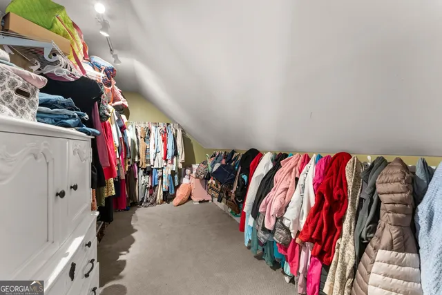 a view of a house with a yard and furniture