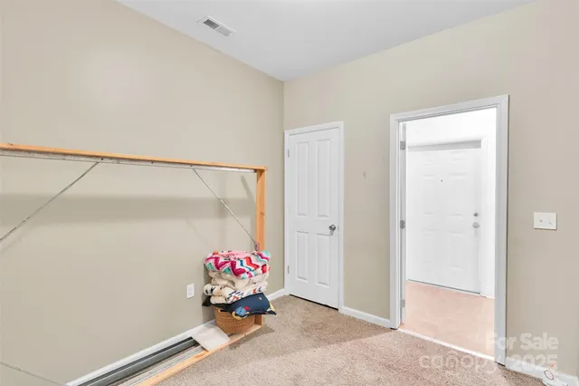 a white toilet sitting next to a white sink
