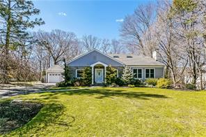 39 Windingwood Road North Rye Brook, NY 10573 - Photo 1 of 1 a front view of a house with a yard table and chairs