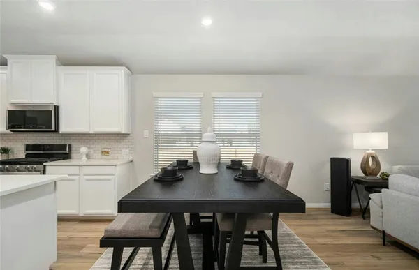 a view of a dining room with furniture