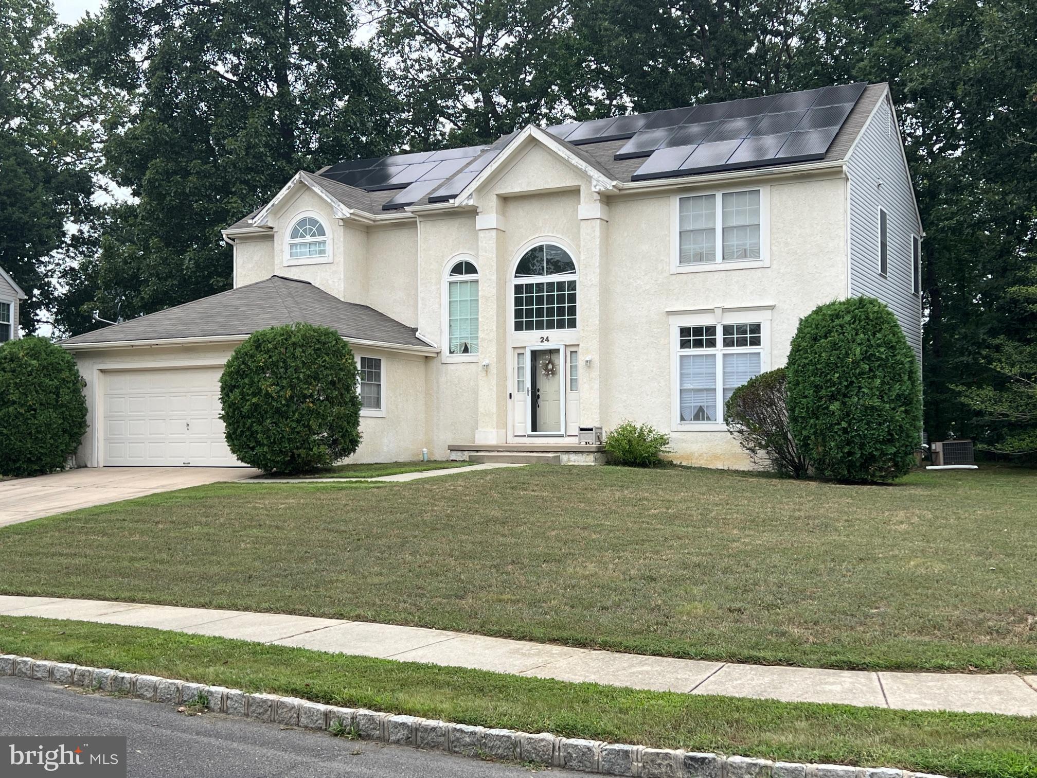 24 Brookstone Drive Sicklerville, NJ 08081 - Photo 1 of 22 a front view of a house with a garden