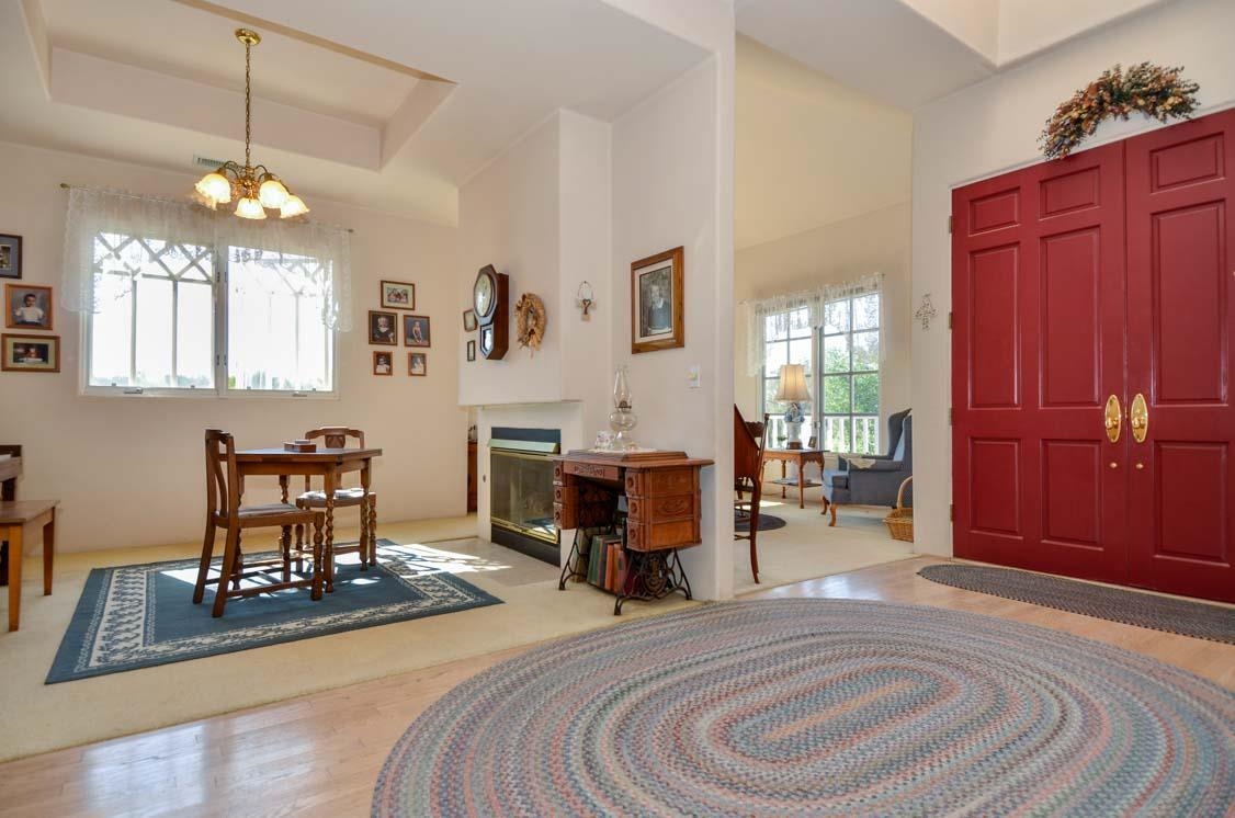 4132 Olive Hill Road Fallbrook, CA 92028 - Photo 3 of 25 Formal Entry with Living Room and Dining Room Sharing Two-Sided Fireplace