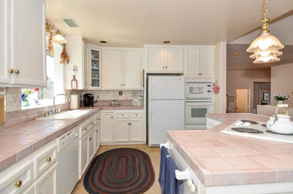 4132 Olive Hill Road Fallbrook, CA 92028 - Photo 7 of 25 Sunny Kitchen with Oodles of Storage