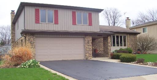 257 North Baynard Road Addison, IL 60101 - Photo 1 of 1 a front view of a house with garden