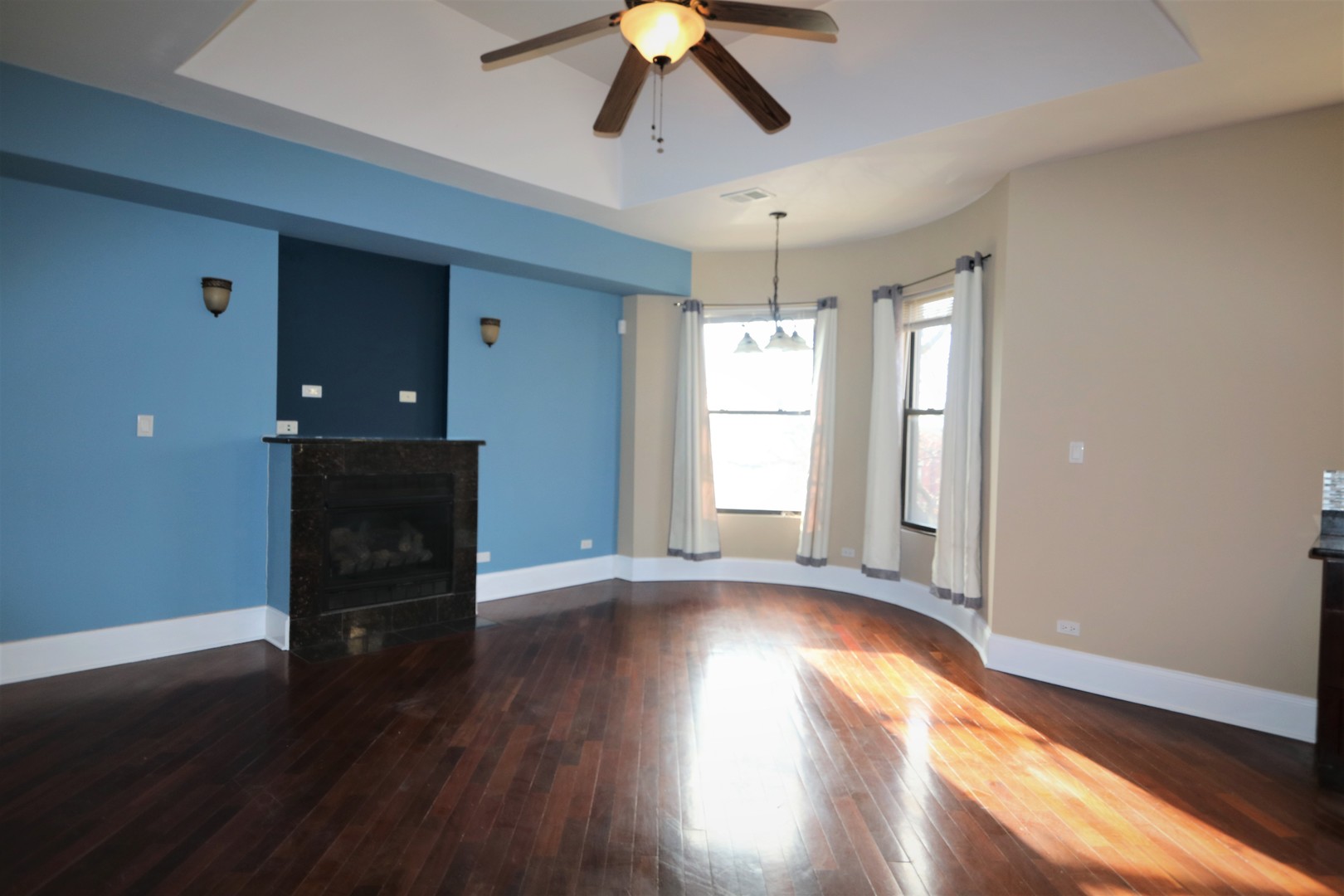 5203 South Indiana Avenue, Unit 3 Chicago, IL 60615 - Photo 3 of 15 a view of empty room with wooden floor and fan