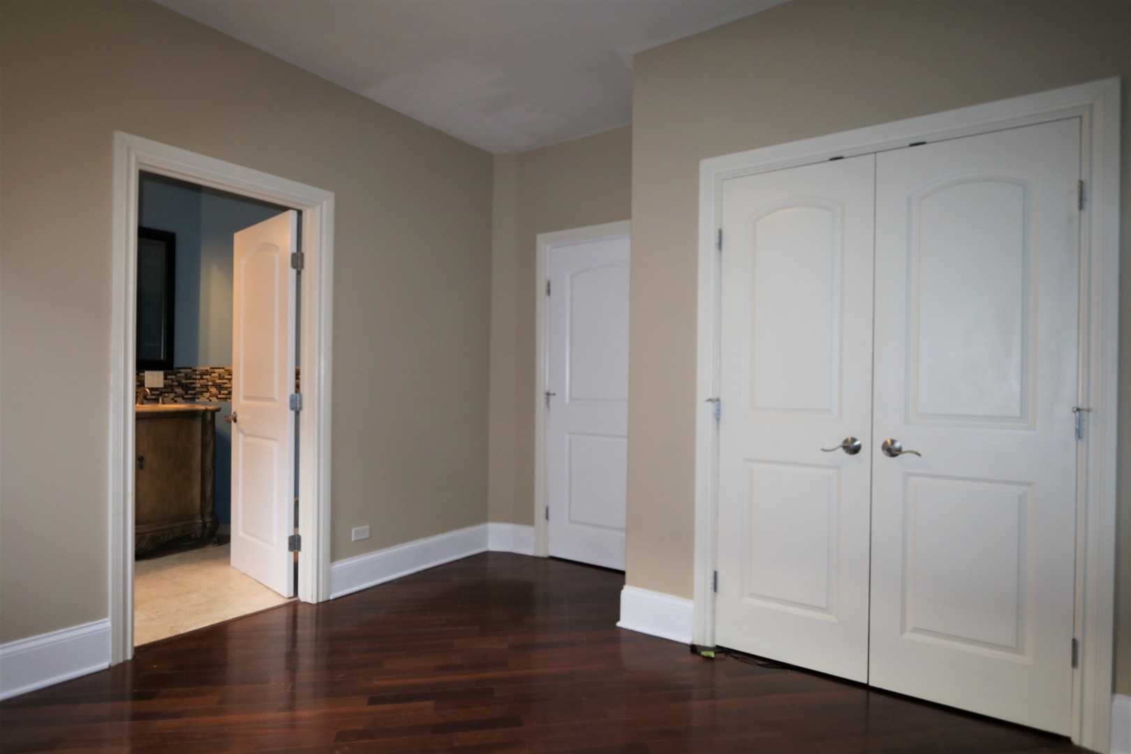 5203 South Indiana Avenue, Unit 3 Chicago, IL 60615 - Photo 8 of 15 a view of an empty room with wooden floor