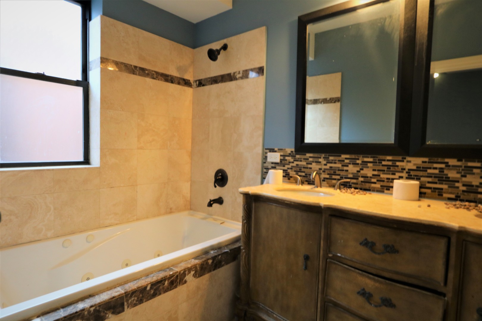 5203 South Indiana Avenue, Unit 3 Chicago, IL 60615 - Photo 10 of 15 a bathroom with a sink and a bathtub